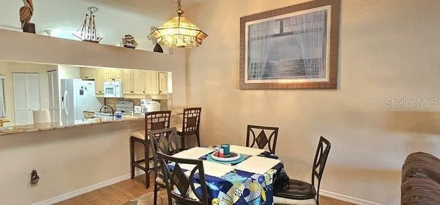 a living room with furniture a flat screen tv and a window