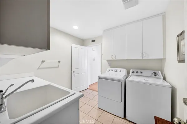 a view of storage and utility room with washer and dryer