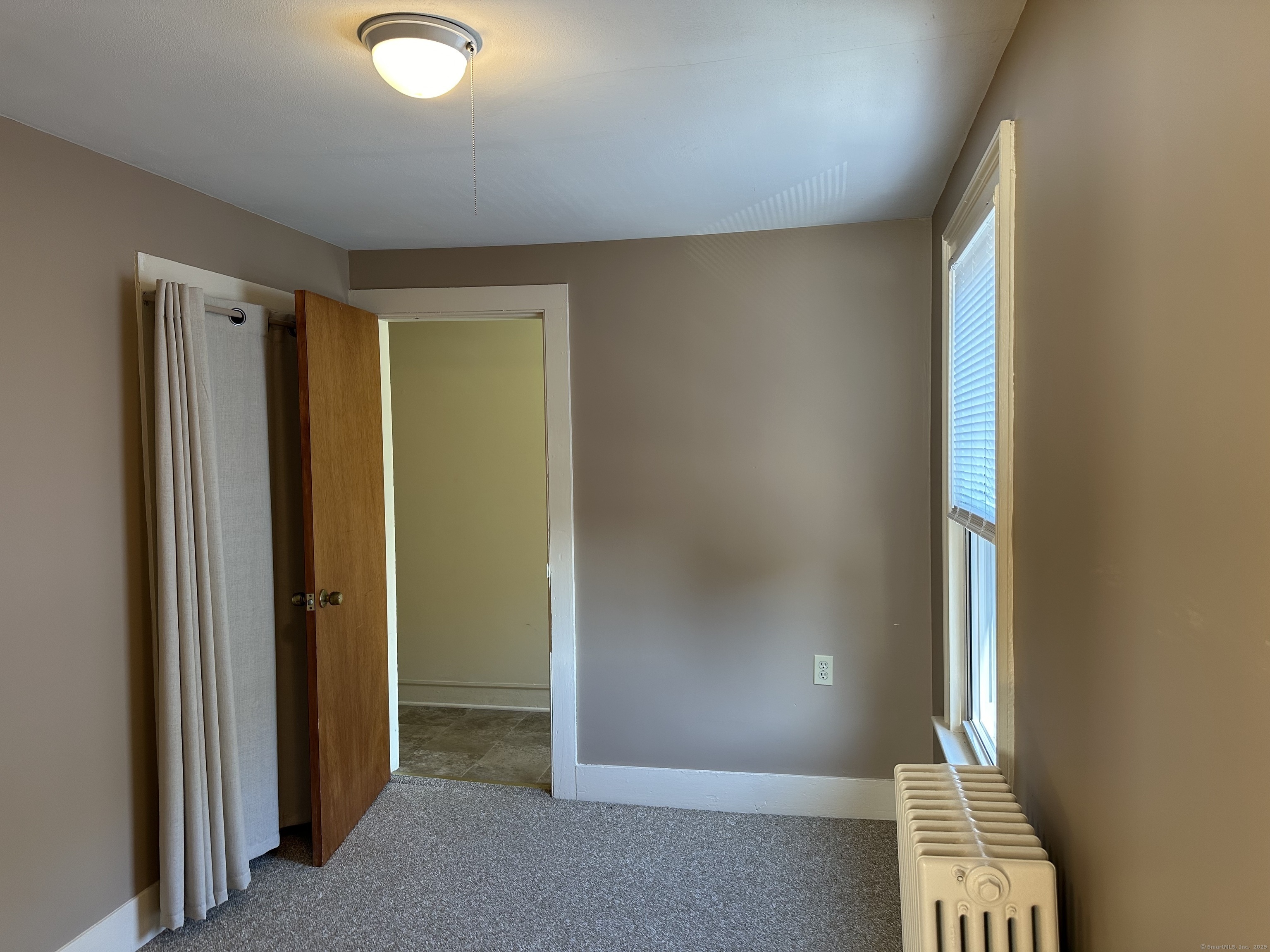 96 Main Street, Unit 2 Branford, CT 06405 - Photo 7 of 10 an empty room with windows