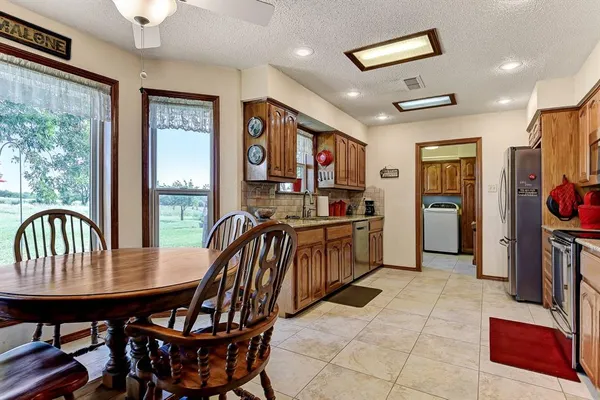 a view of a dining room with furniture window and outside view