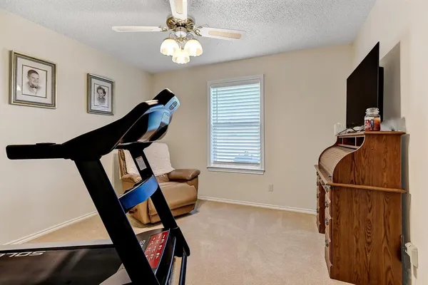 a view of a livingroom with furniture and windows