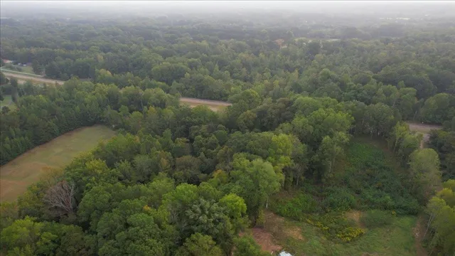 a view of a field with an outdoor space