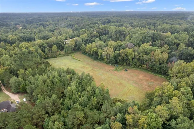 a view of a big yard with green space