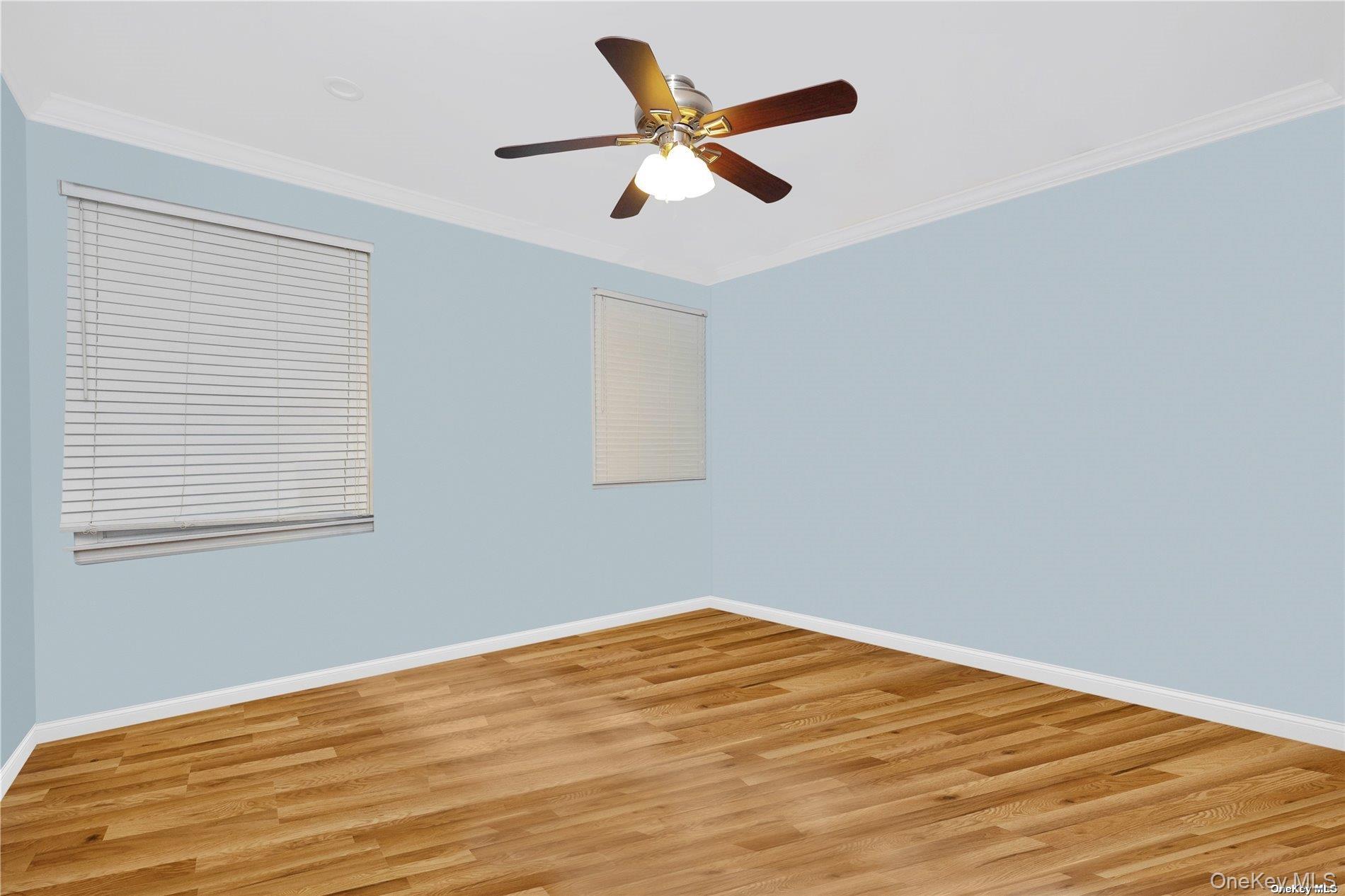 245 West Chester Street Long Beach, NY 11561 - Photo 16 of 31 Unfurnished room featuring crown molding, wood finished floors, and ceiling fan