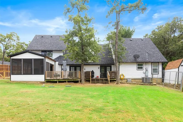 a front view of a house with a yard table and chairs