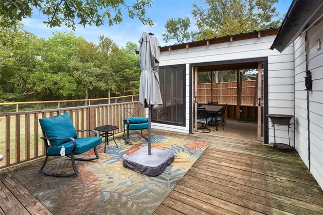 a view of a chairs and table on the wooden floor