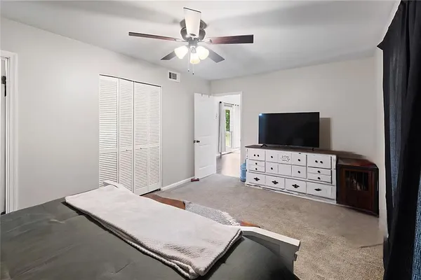 a living room with flat screen tv and furniture
