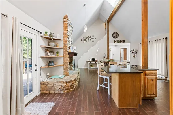 a very nice looking room with many windows and furniture