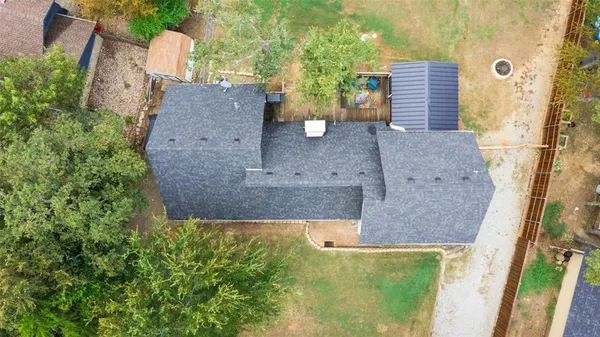 aerial view of a house with a yard