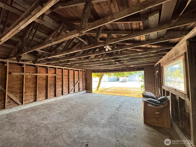 wooden floor in an empty room with a fireplace