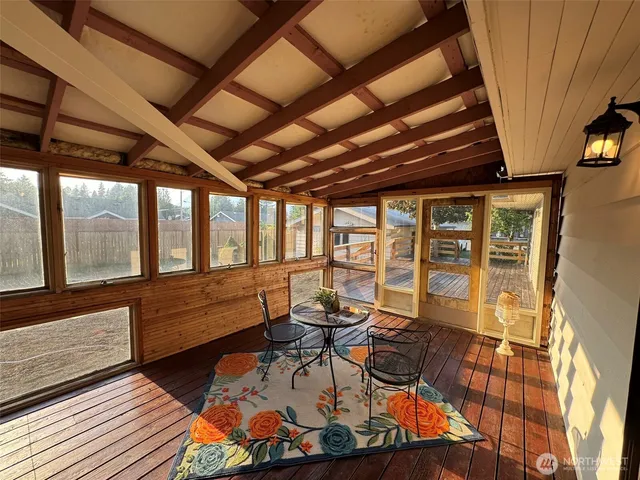 a view of empty room with wooden ceiling