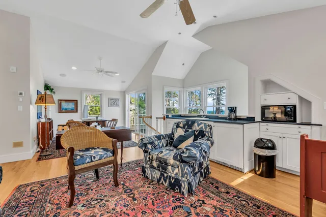 a view of a livingroom with furniture and staircase