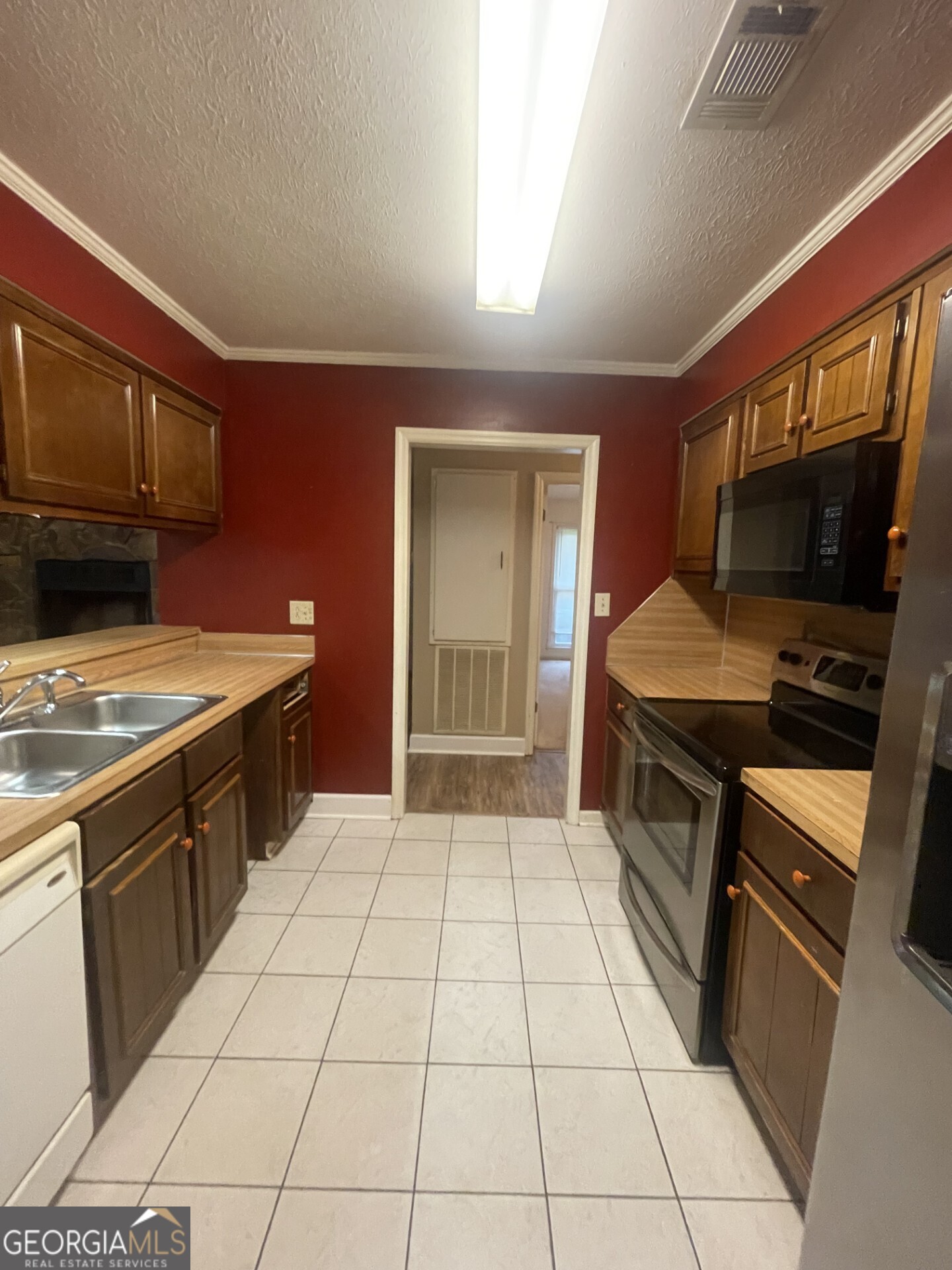 200 Cheyenne Drive LaGrange, GA 30240 - Photo 11 of 22 a kitchen with a sink a stove and cabinets