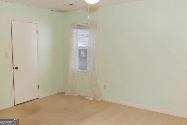 a kitchen with a refrigerator and a stove