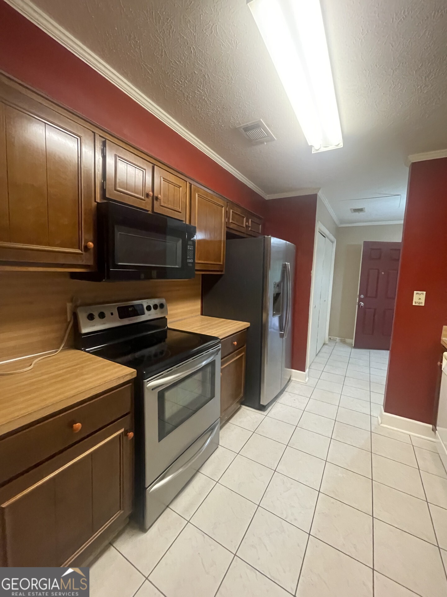 200 Cheyenne Drive LaGrange, GA 30240 - Photo 8 of 22 a kitchen with stainless steel appliances granite countertop a refrigerator and a stove top oven