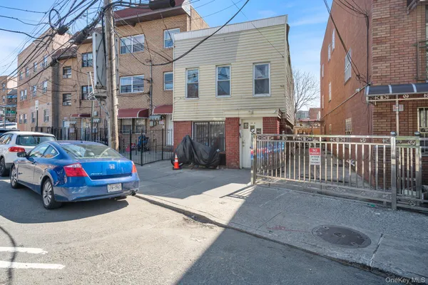a car parked in front of a brick building