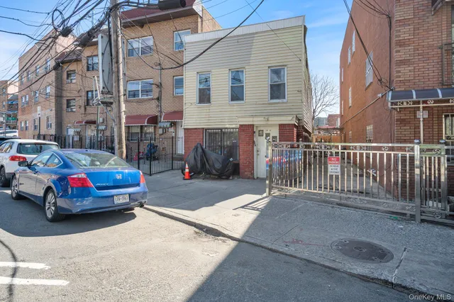 a car parked in front of a brick building