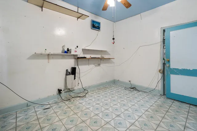 a view of a room with rack and wooden floor