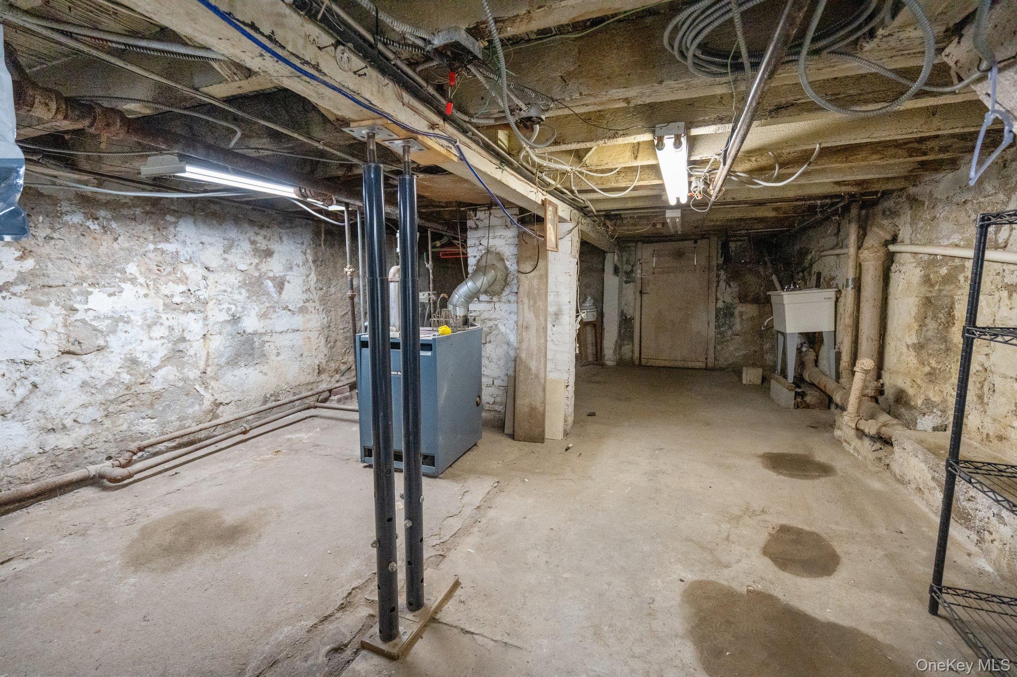 100-30 Martense Avenue Queens, NY 11368 - Photo 30 of 36 View of unfinished basement