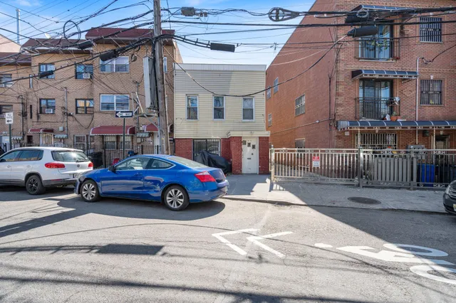 a car parked in front of a brick building