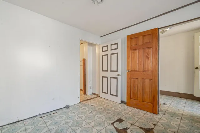 a view of a hallway with closet area