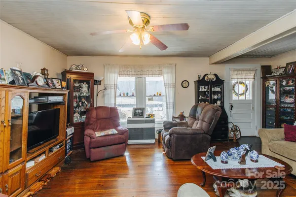 a living room with furniture fireplace and a flat screen tv