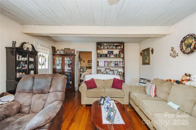 a living room with furniture and book shelf