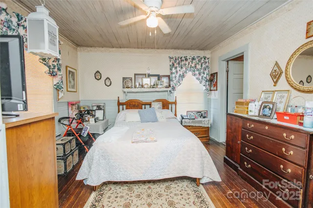 a bed room with a bed and a dresser