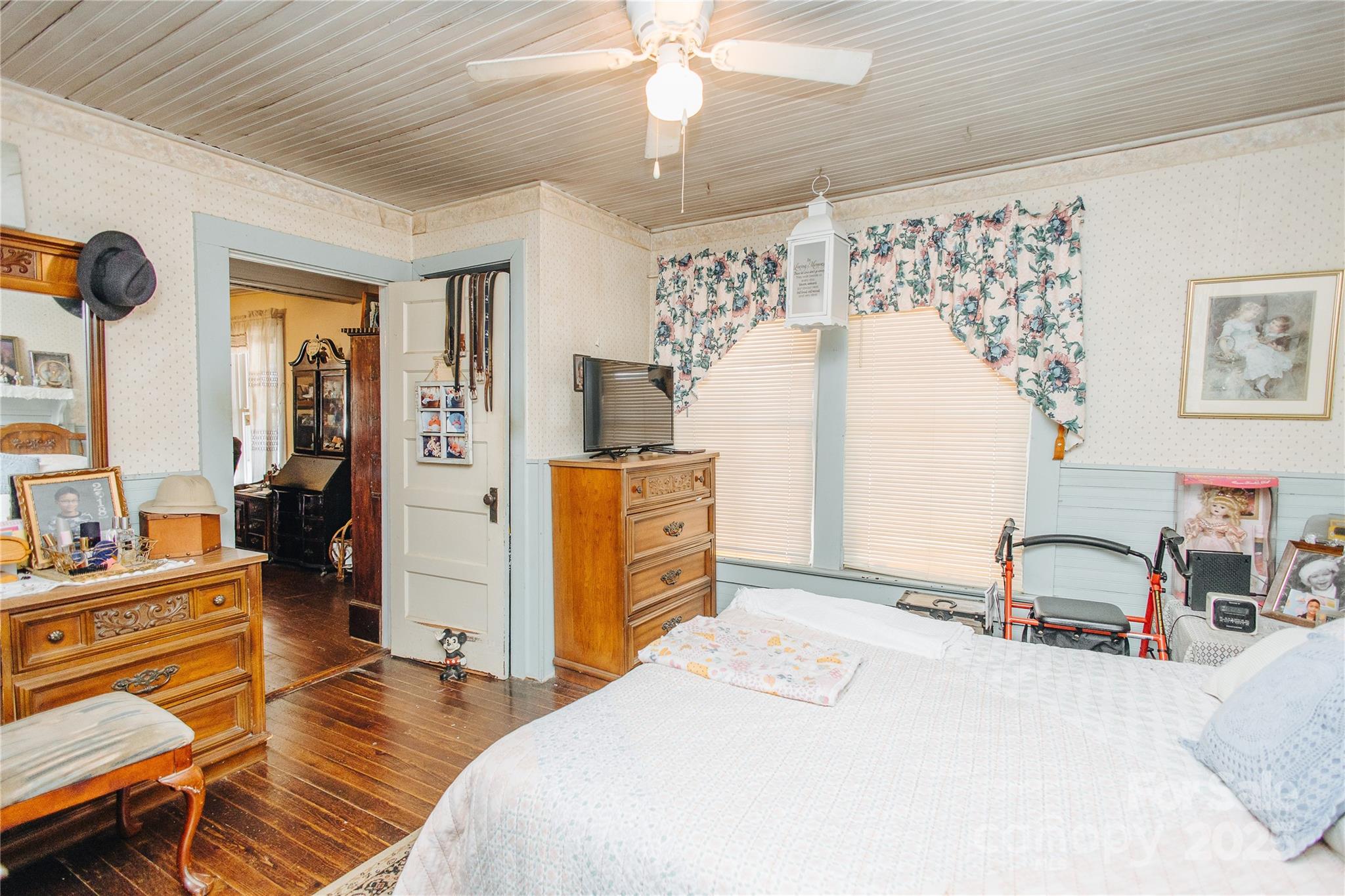 63 Clear Creek Road Marion, NC 28752 - Photo 15 of 38 a bedroom with a bed and a chandelier