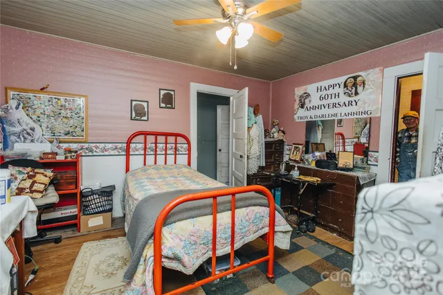 a bedroom with furniture and a chandelier