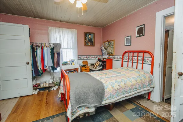 a bedroom with bed and a window