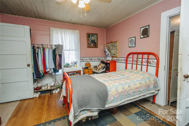 a bedroom with bed and a window