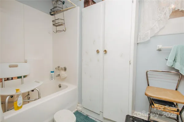 a bathroom with a bathtub and sink