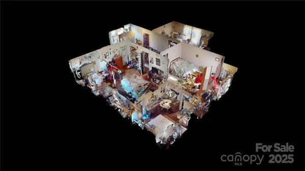 a bed sitting in a bedroom next to a lamp