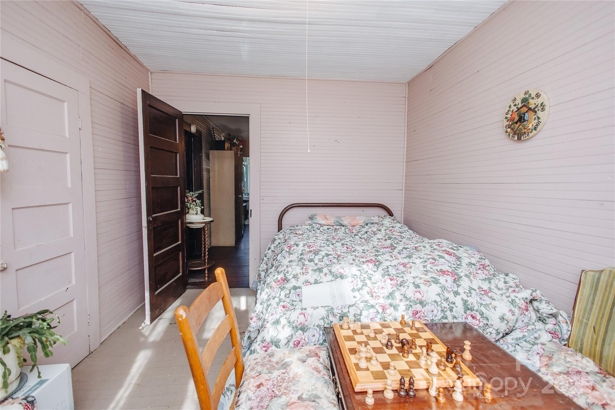 63 Clear Creek Road Marion, NC 28752 - Photo 34 of 38 a bedroom with a bed and a window