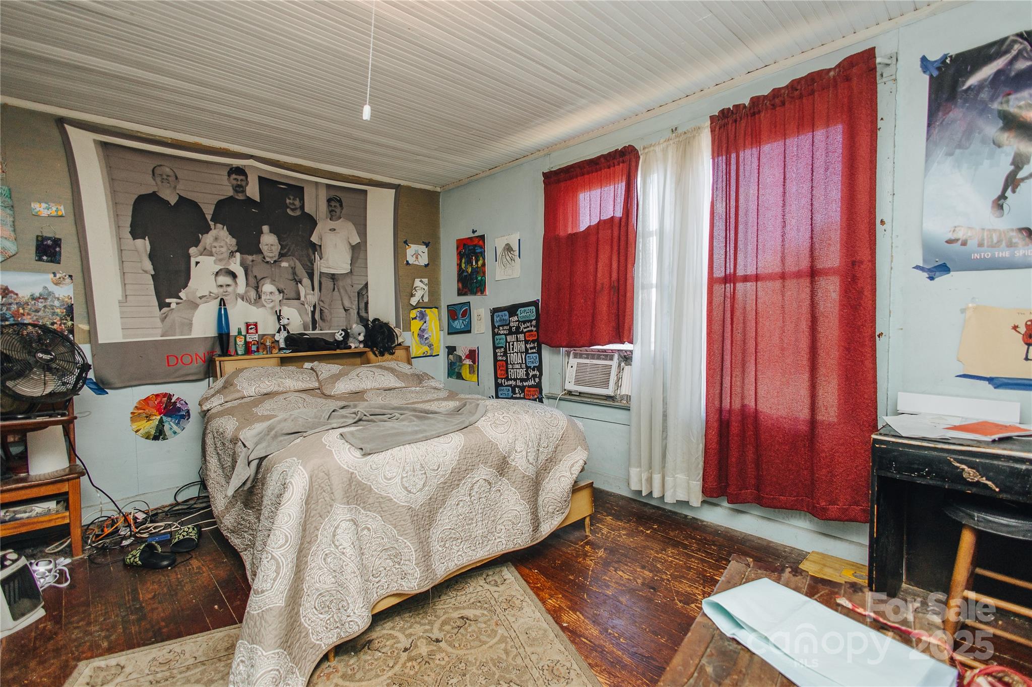 63 Clear Creek Road Marion, NC 28752 - Photo 36 of 38 a bedroom with a bed and a mirror