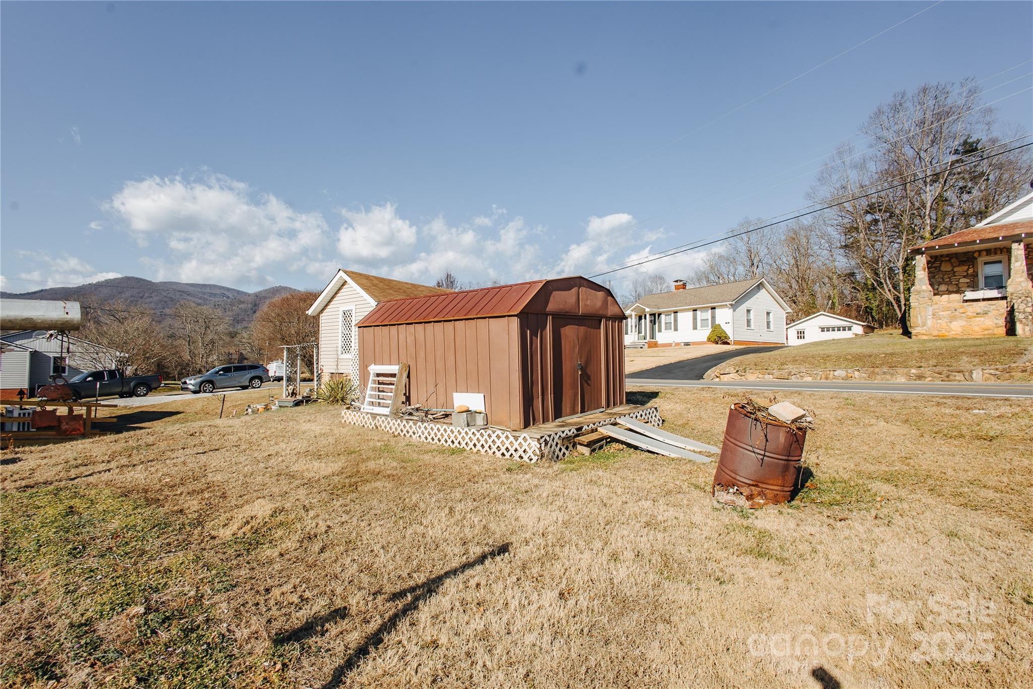 63 Clear Creek Road Marion, NC 28752 - Photo 10 of 38 a street view with residential house