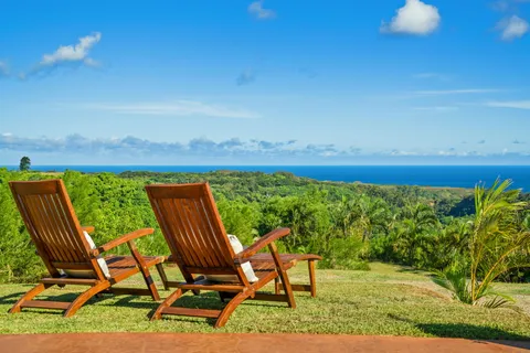 a view of a chairs and table in patio