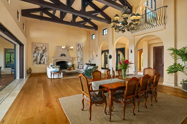 a view of entryway livingroom and hall with wooden floor
