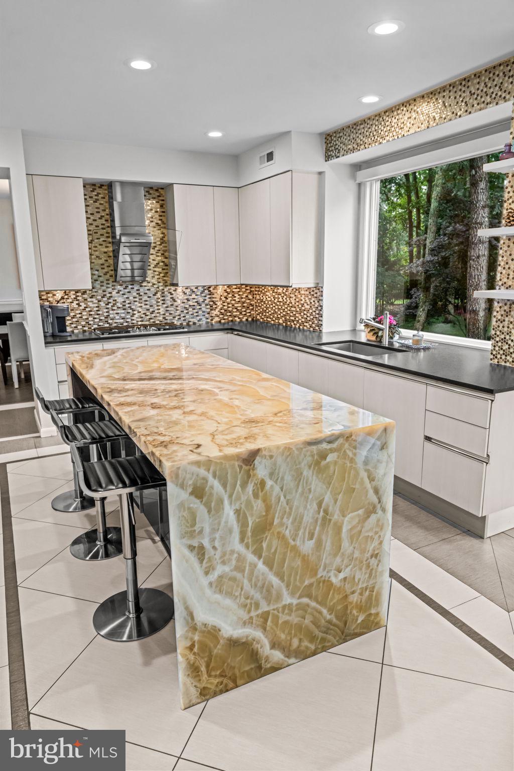 73 Bortons Road Marlton, NJ 08053 - Photo 35 of 99 a large kitchen with granite countertop a table chairs in it and wooden floors