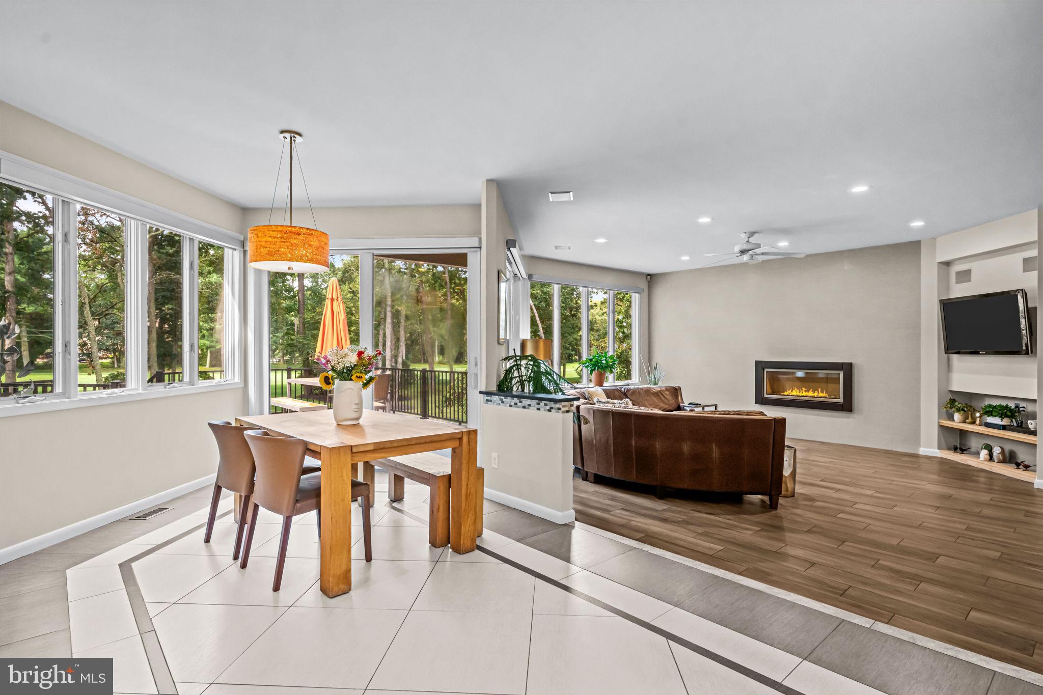 73 Bortons Road Marlton, NJ 08053 - Photo 40 of 99 a living room with furniture a flat screen tv and a large window
