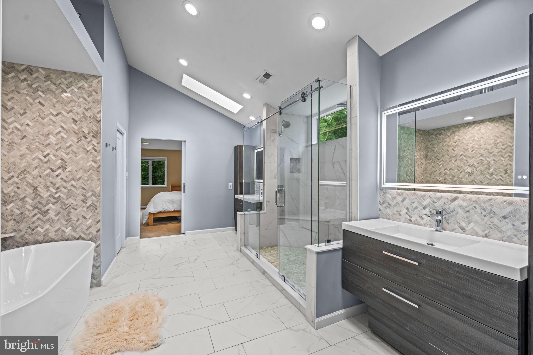 73 Bortons Road Marlton, NJ 08053 - Photo 59 of 99 a spacious bathroom with a tub sink shower and mirror