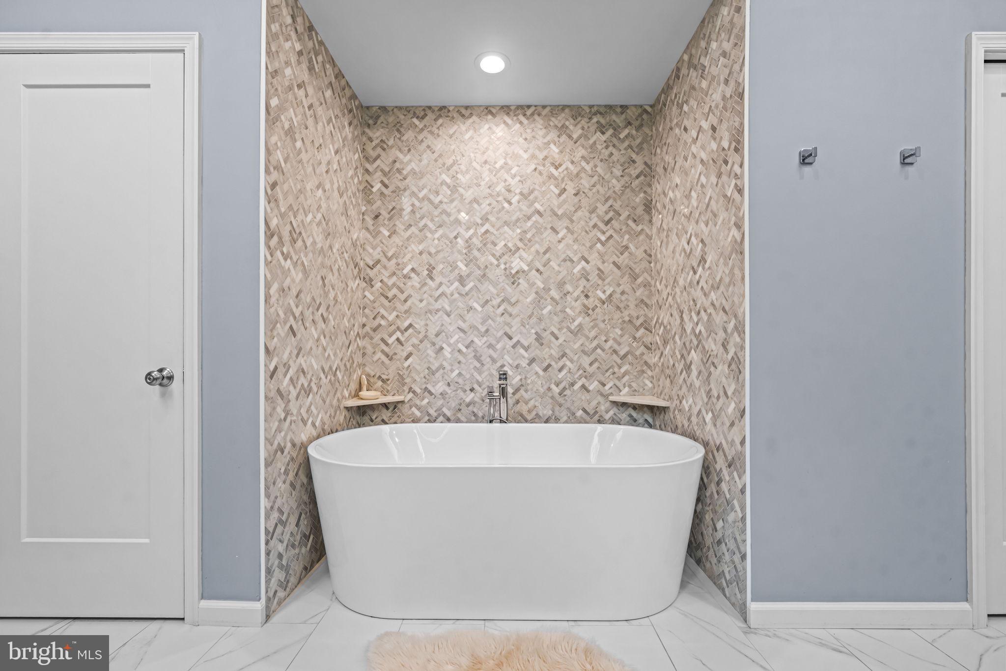 73 Bortons Road Marlton, NJ 08053 - Photo 60 of 99 a white bath tub sitting in a bathroom