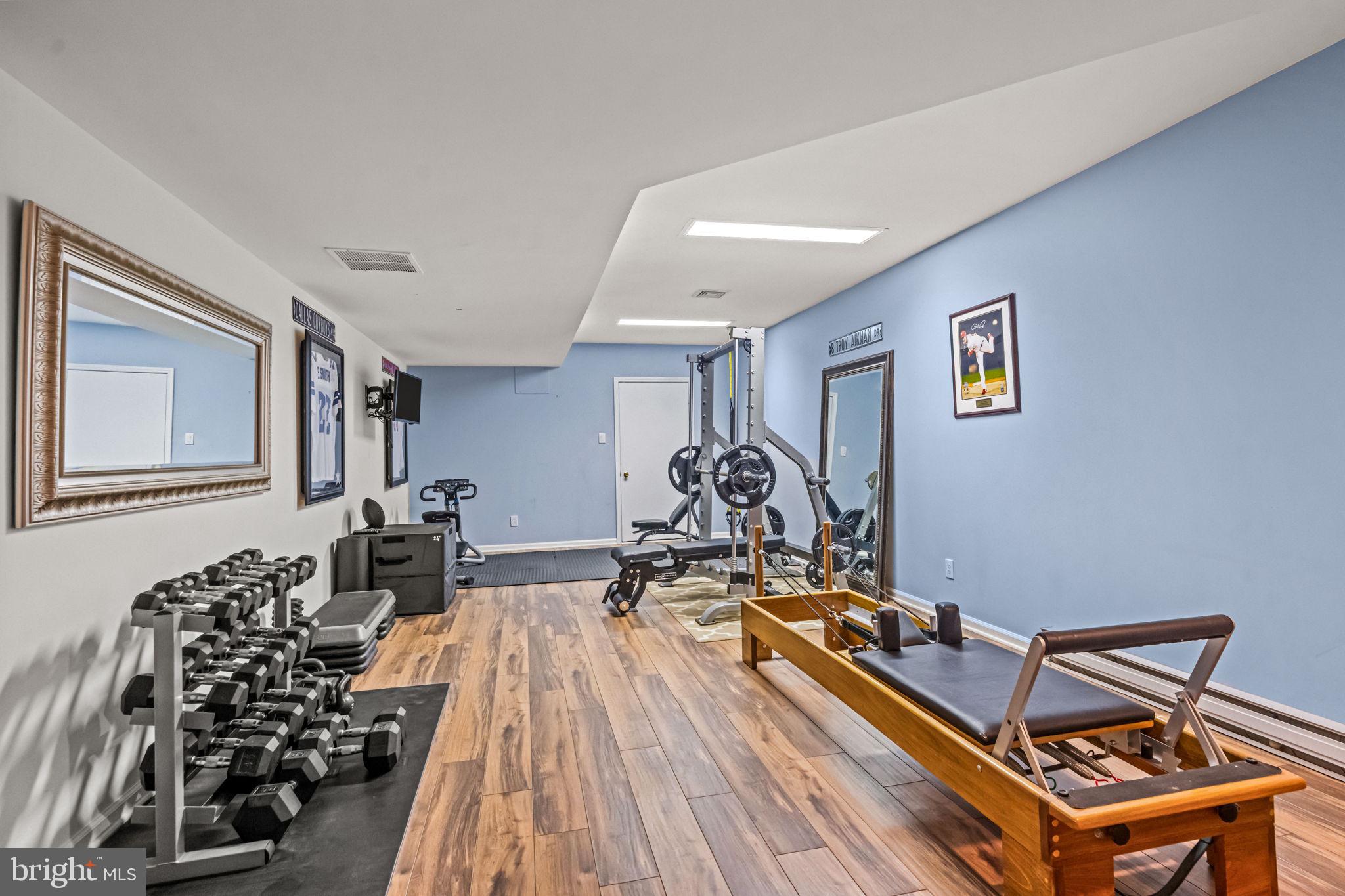73 Bortons Road Marlton, NJ 08053 - Photo 79 of 99 a room with gym equipment and wooden floor