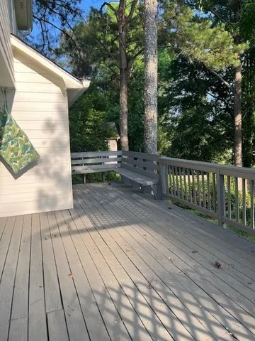a view of deck with wooden floor and seating space