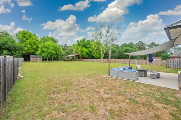 a view of a swimming pool with an outdoor space and seating area