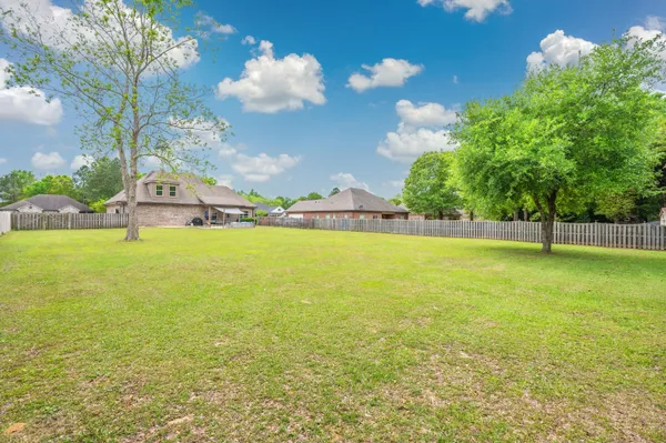 a front view of a house with outdoor seating