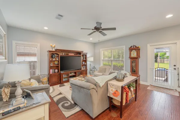a living room with furniture and a flat screen tv