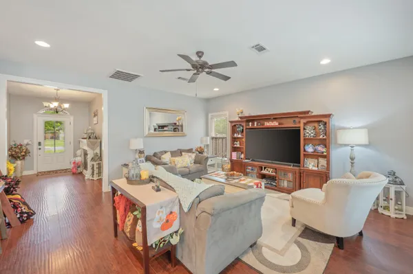 a living room with furniture and a flat screen tv