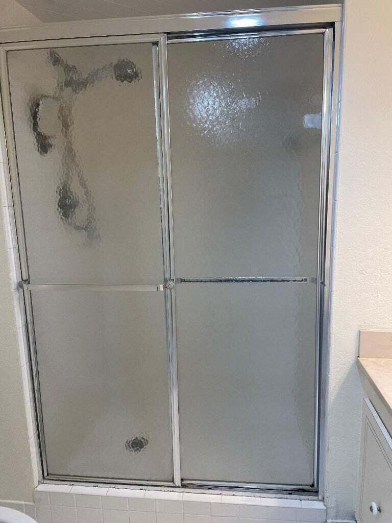 6300 Northwest 2nd Avenue, Unit 305 Boca Raton, FL 33487 - Photo 20 of 27 a bathroom with a glass shower door